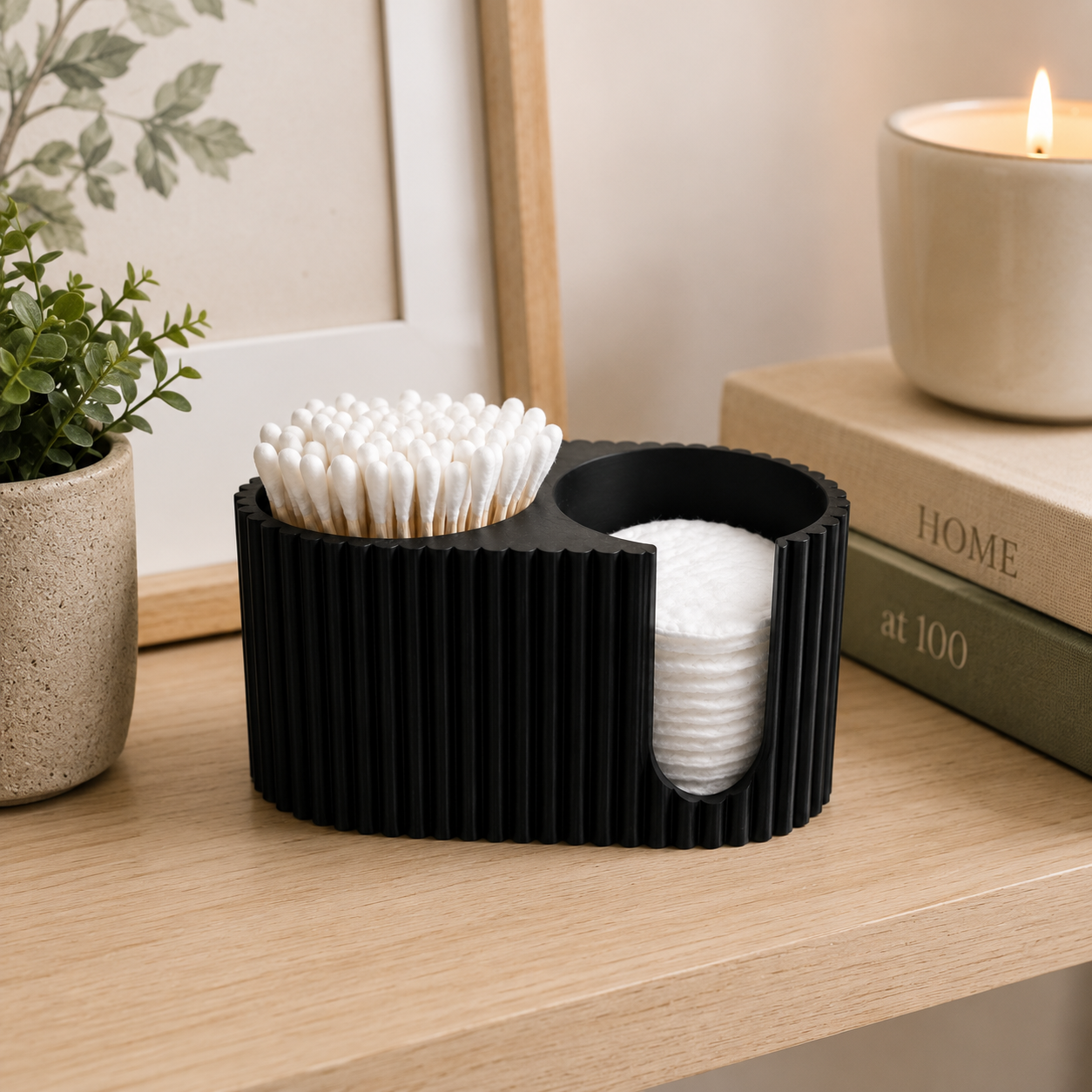 Modern cotton swab and cotton pad organizer styled on a contemporary bathroom shelf with home décor.