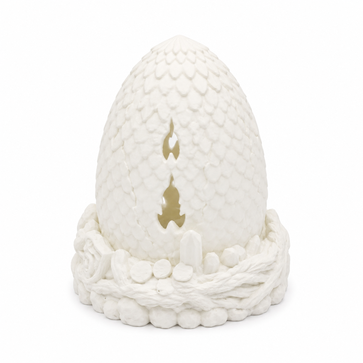 Side profile of white Dragon Egg Fairy Lamp showing dragon scale texture and nest details.