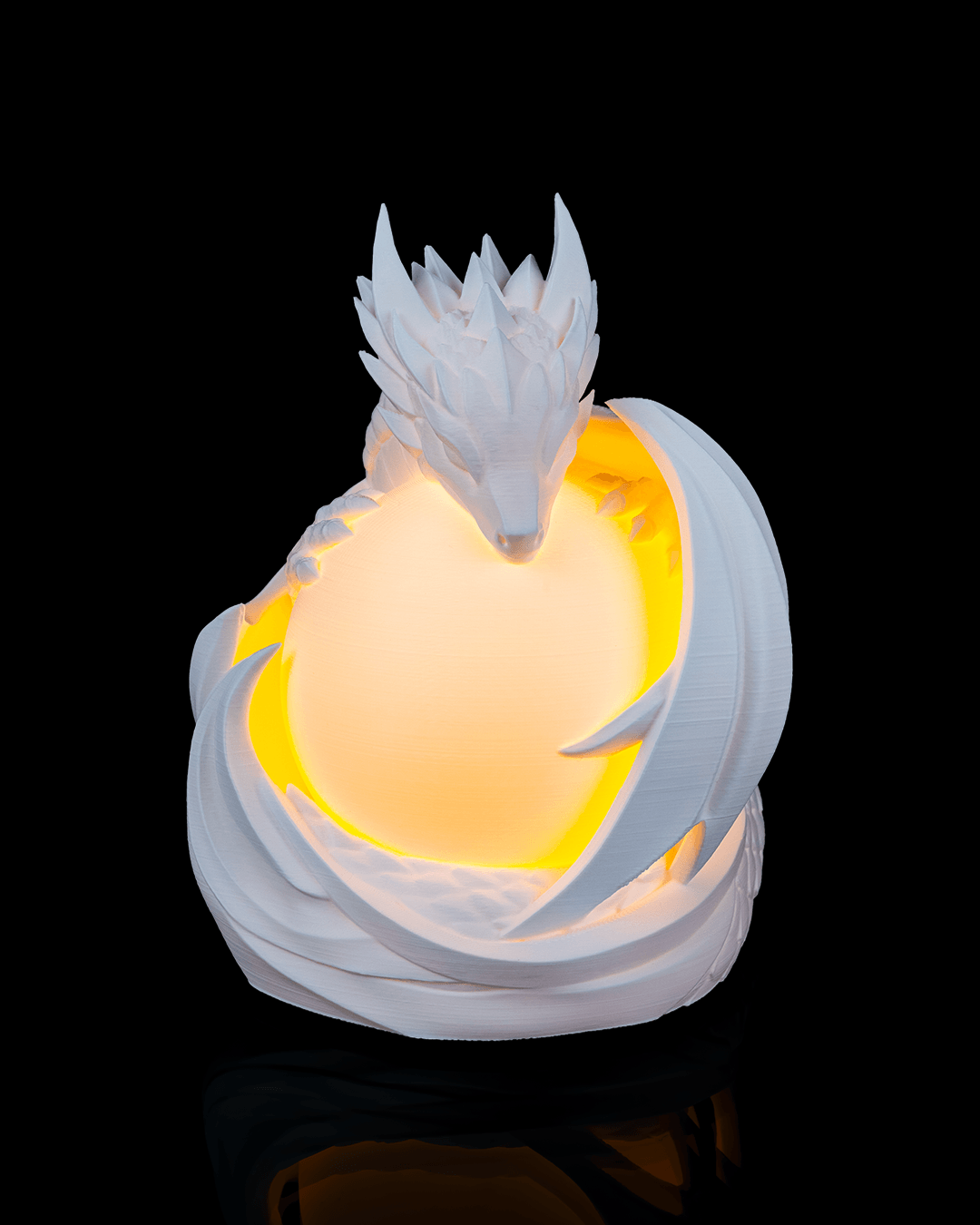 White dragon-shaped night light on a black background