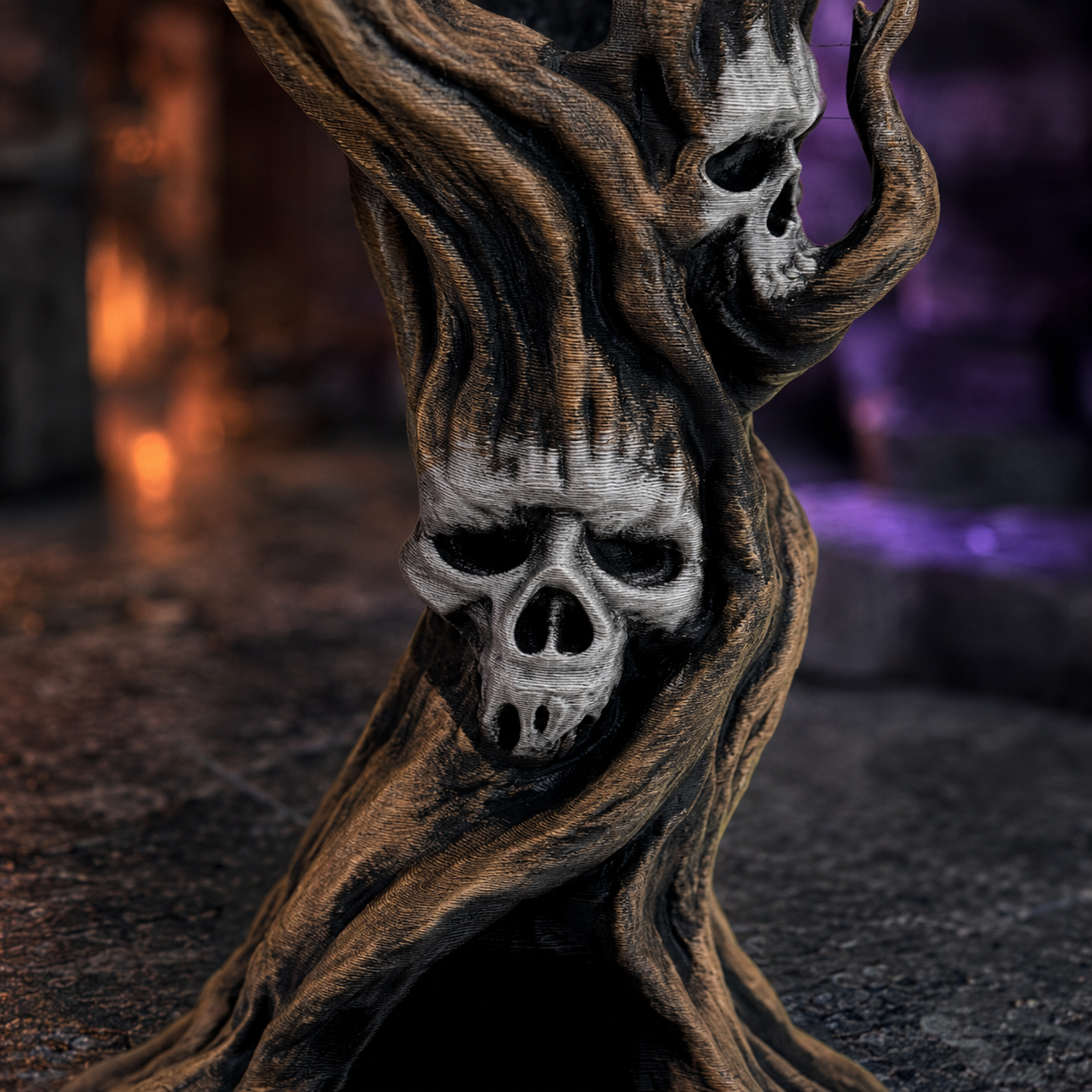 A gothic decorative sculpture shaped like a twisted tree trunk with three carved skull faces embedded in the bark, set against a dark moody background with warm orange and purple light flares.