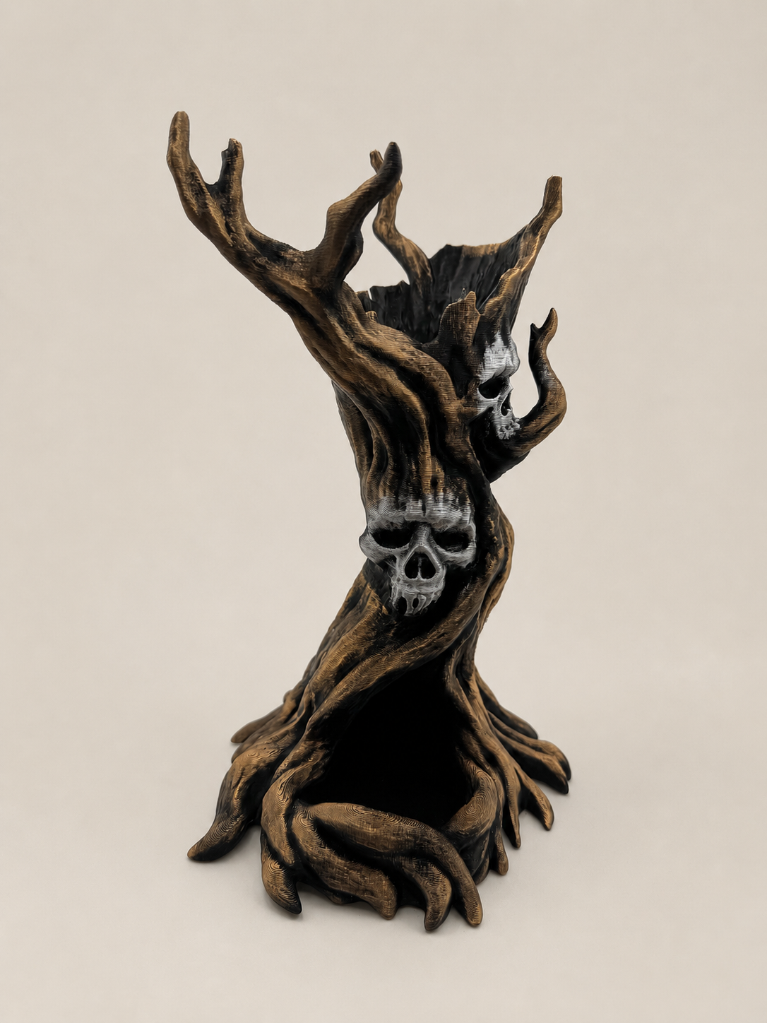 A gothic decorative sculpture of a gnarled tree trunk with skull details, set against a plain beige background.