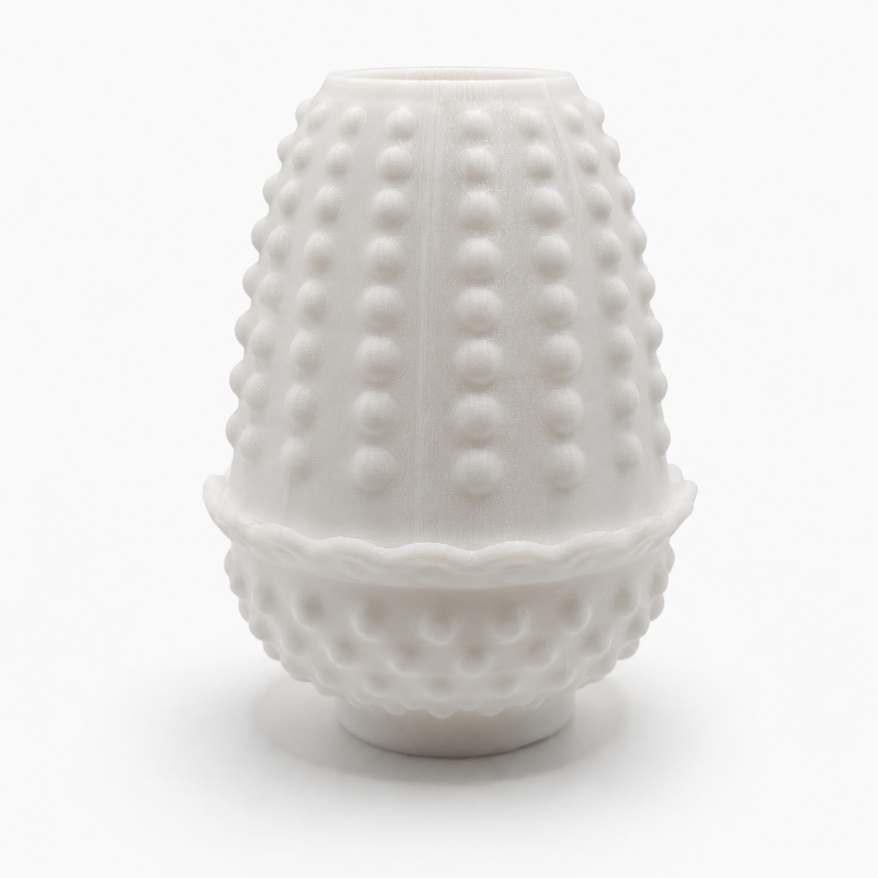 Front view of a white hobnail fairy lamp with raised dot texture, scalloped middle rim, and rounded base on a clean white background.