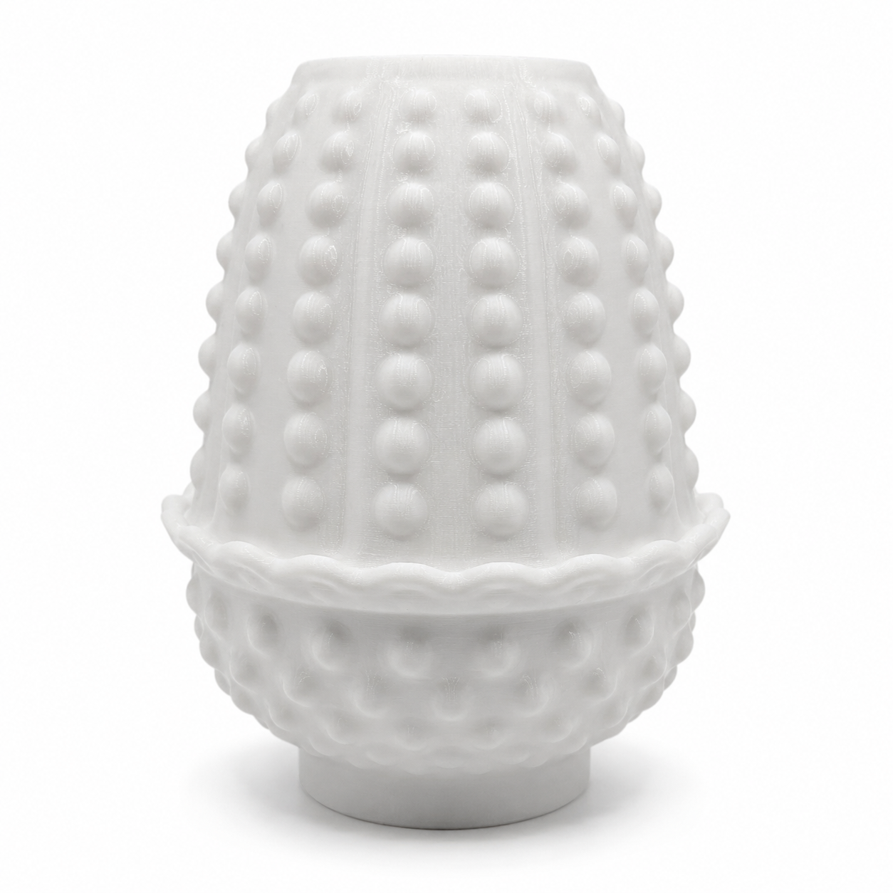 Side view of a white 3D printed hobnail fairy lamp showing the textured shade, scalloped edge, and rounded decorative base.