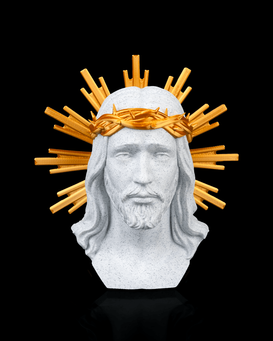Statue of a religious figure with a gold crown of thorns on a black background