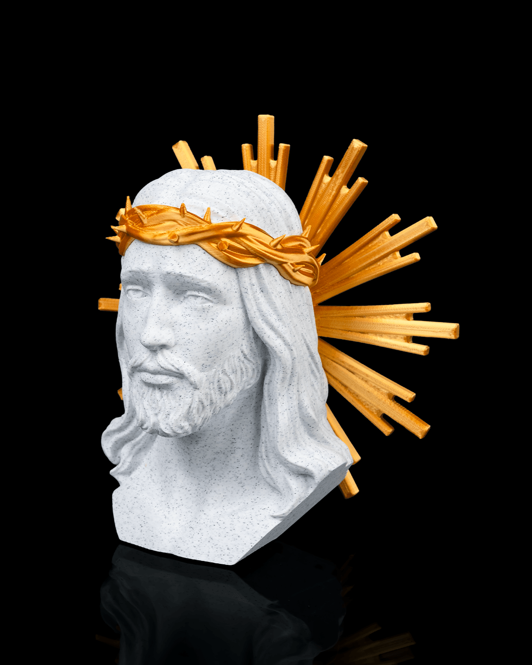 Bust of a religious figure with a gold crown of thorns on a black background
