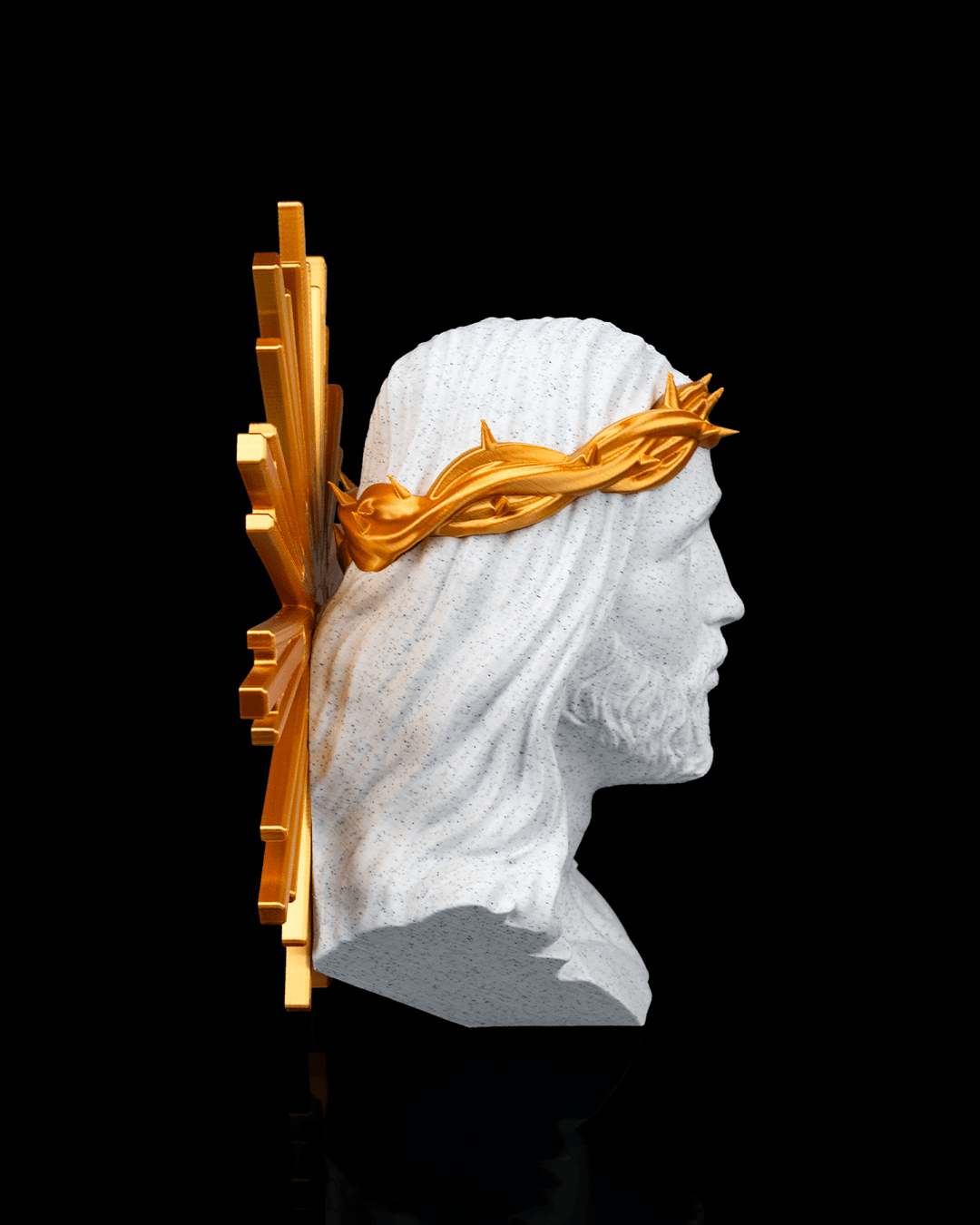 Bust of a classical figure with a gold crown on a black background