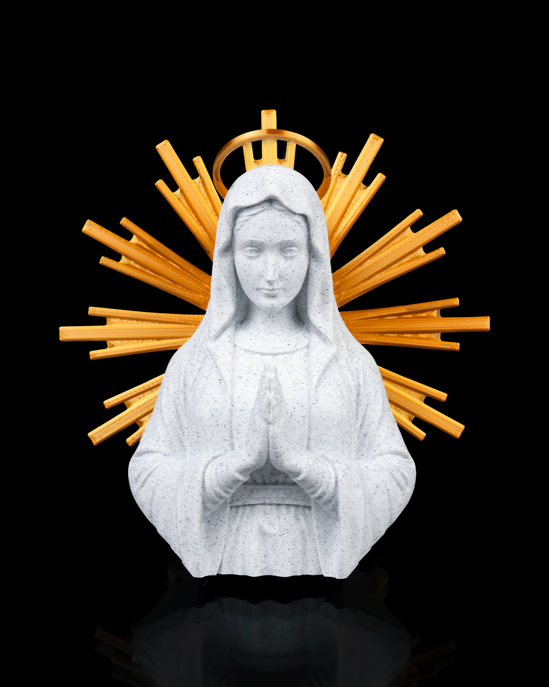 Statue of a religious figure with a gold halo on a black background