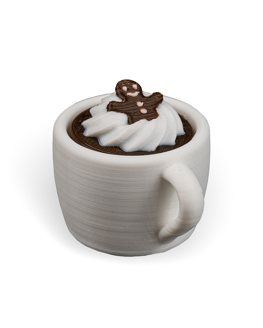 White ceramic mug with hot chocolate and whipped cream, topped with a gingerbread man decoration on a white background.