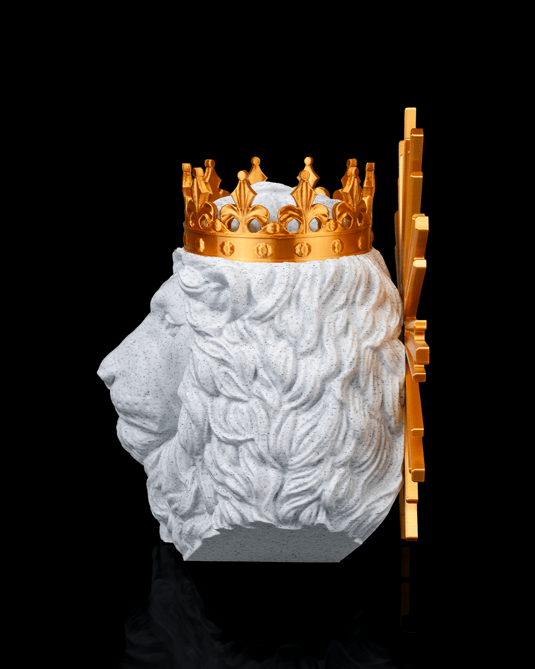 Statue of a bearded figure with a gold crown on a black background
