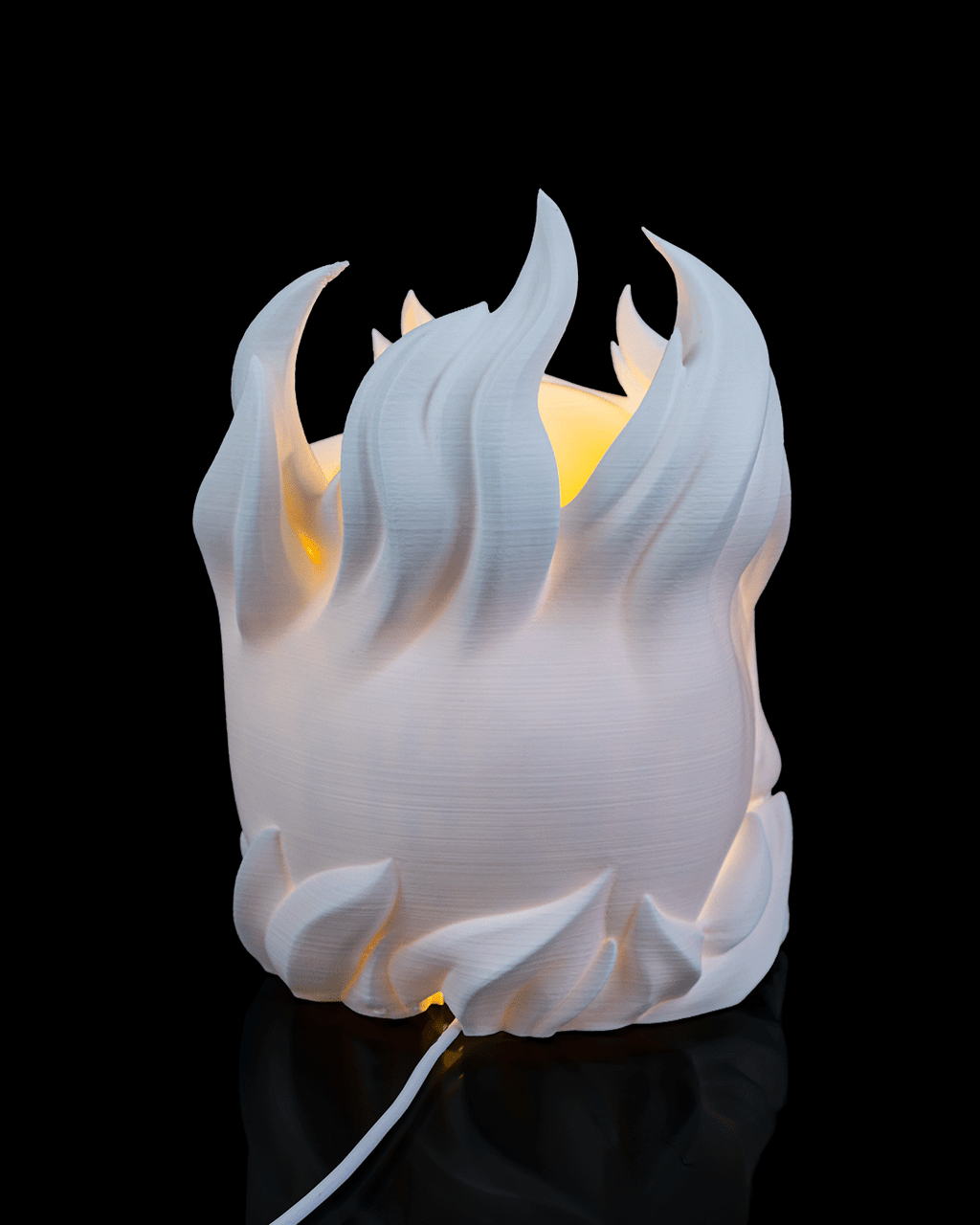 White flame-shaped lamp on a black background