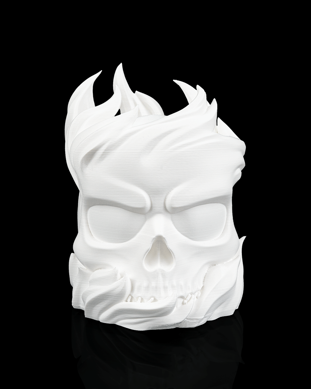 White skull-shaped mask with flames on a black background