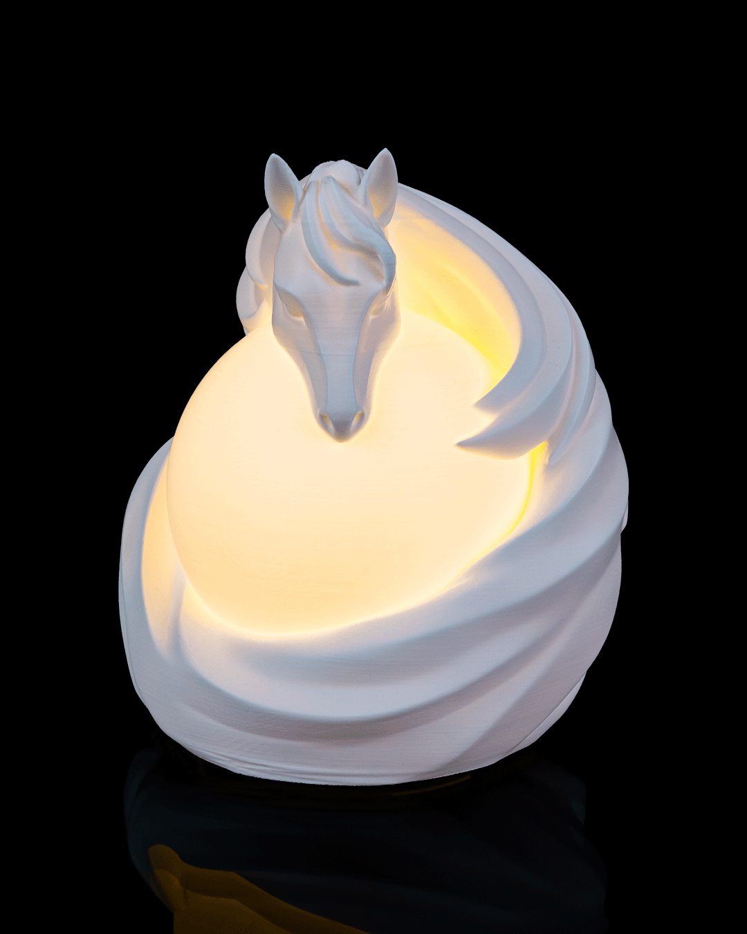 White horse-shaped night light on a black background
