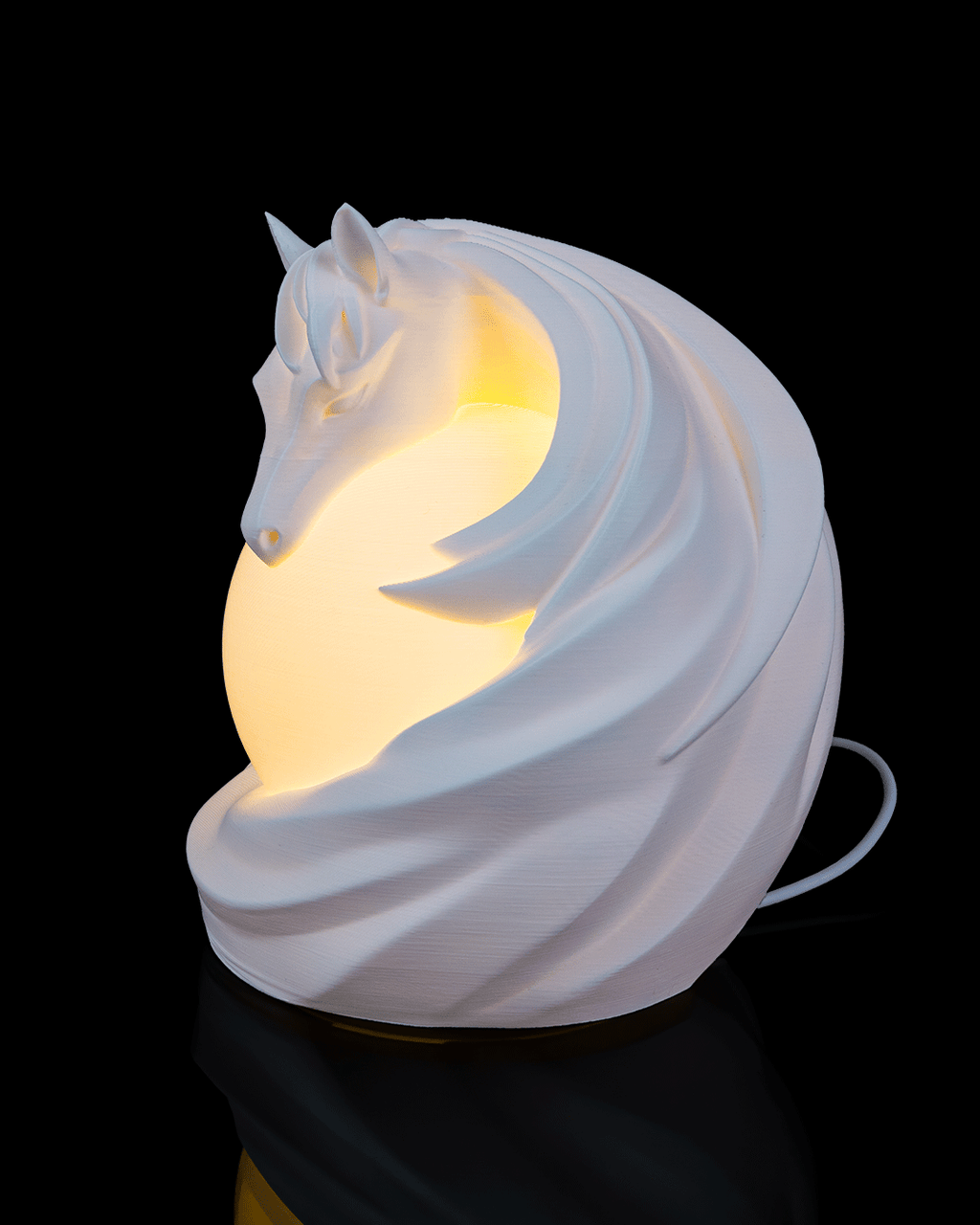 White horse-shaped night light on a black background