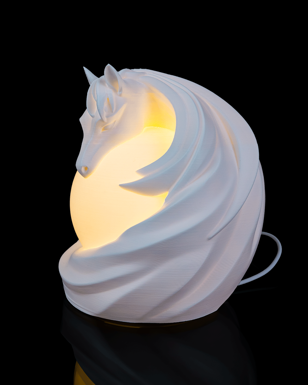 White horse-shaped night light on a black background