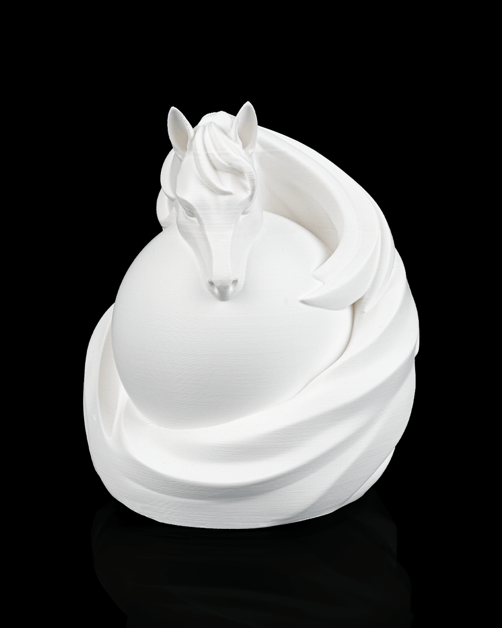 White ceramic horse figurine on a black background