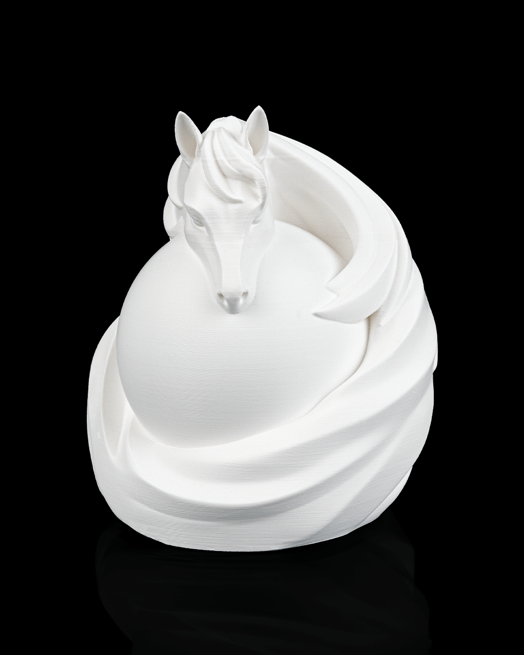 White ceramic horse figurine on a black background