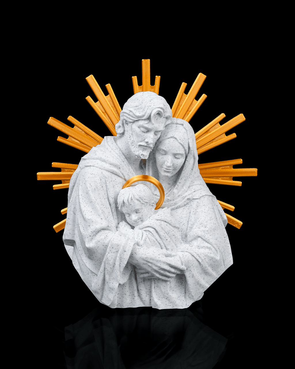 Statue of a holy family with a golden halo against a black background