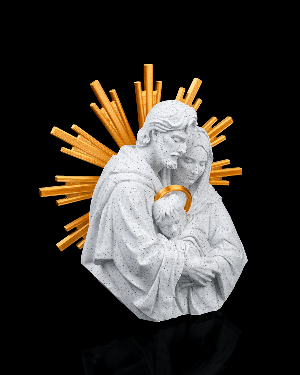 Statue of a religious figure holding a child with a gold halo on a black background