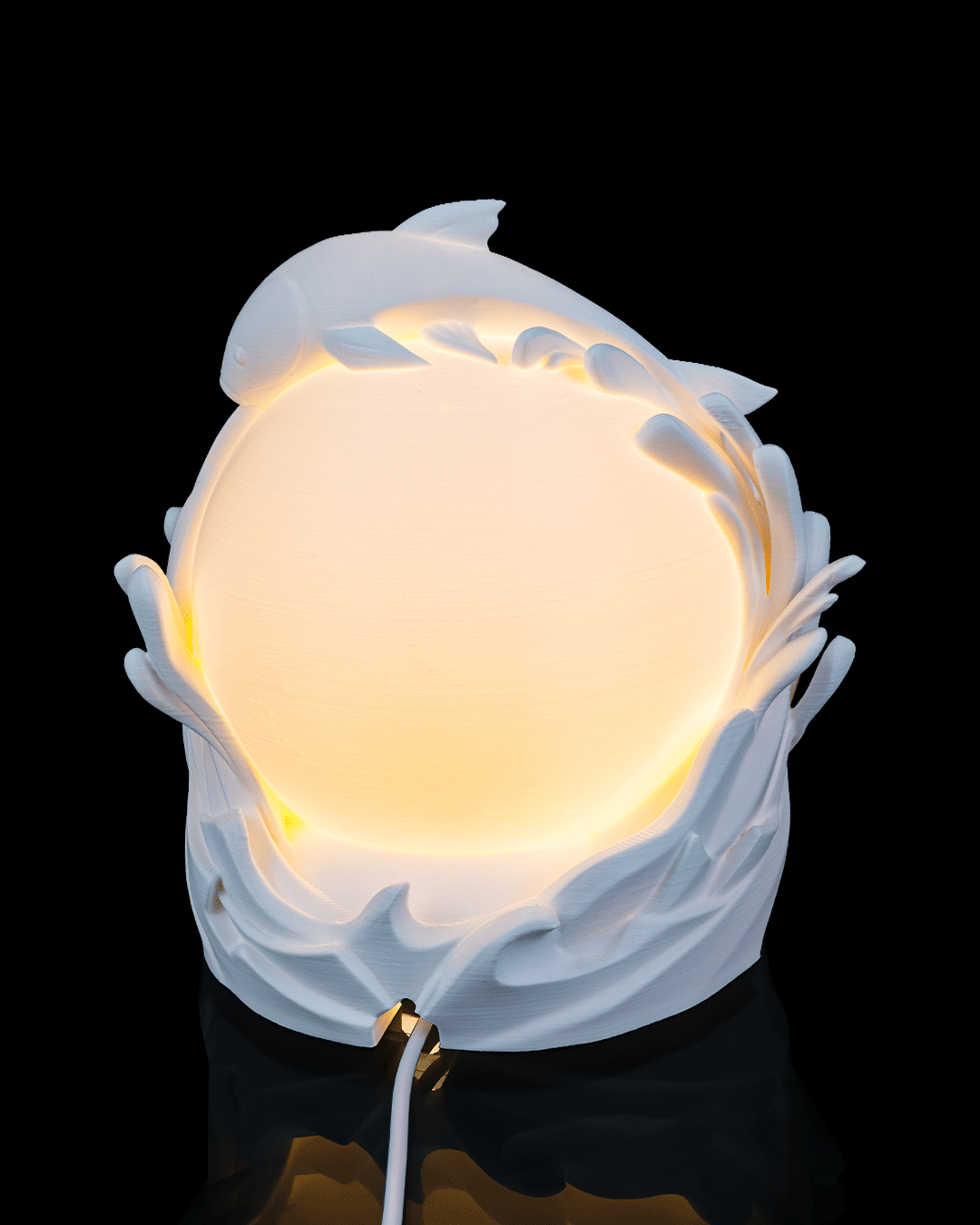 Decorative wall light with a floral design on a black background